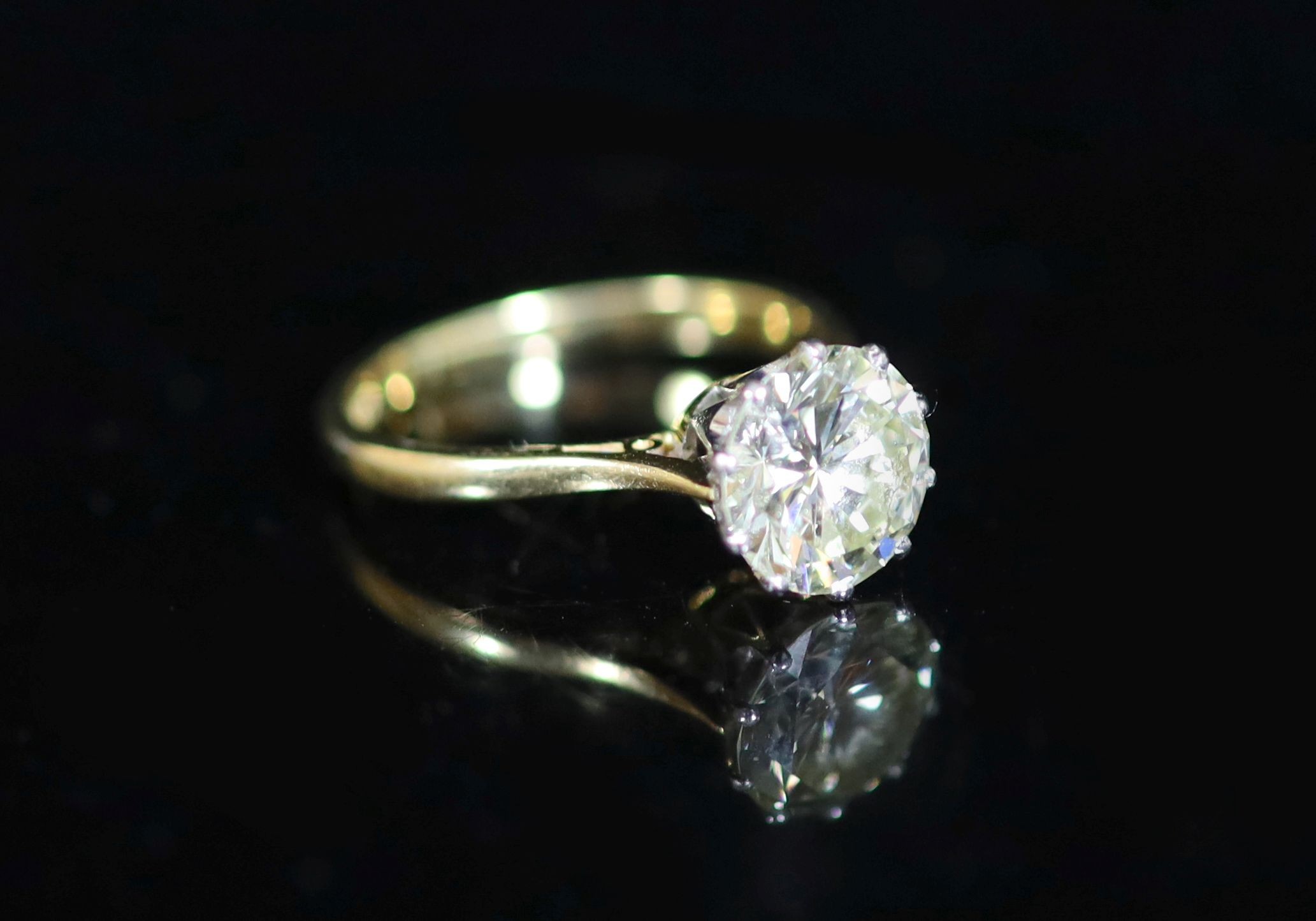 An 18ct gold and solitaire diamond ring